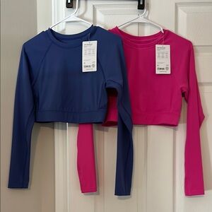 2 Athleta Rashguards Blue and Pink Long Sleeve Crop Tops